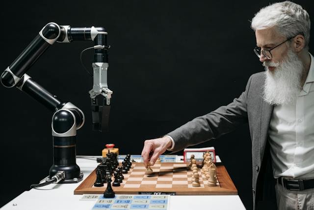 A person and a robotic arm working across a chessboard