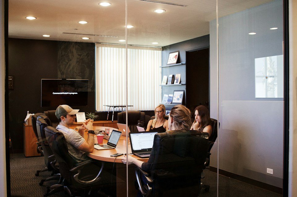Professionals reviewing information together around a conference table