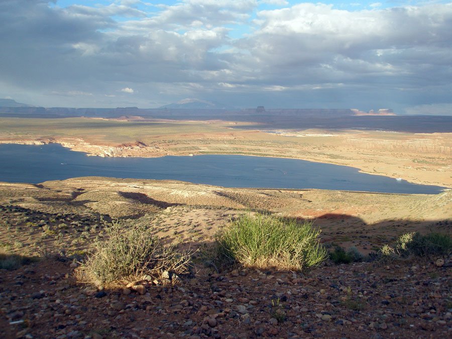 Lake Powell in the Colorado River Basin, with desert cliffs and storm clouds viewed from Wahweap Overlook near Page, Arizona